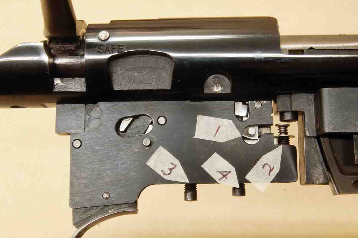 This side view of the Micro-Motion trigger shows engagement surfaces (1), the engagement adjustment screw (2), the pull adjustment screw (3) and the overtravel screw (4).